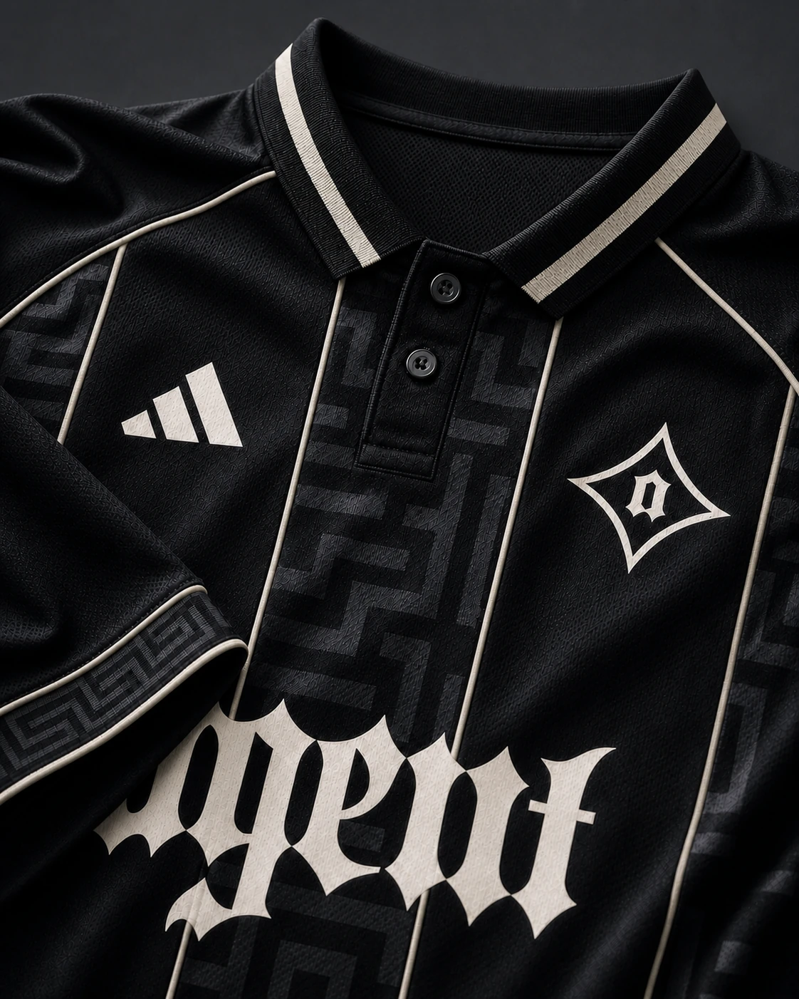 Ivory Agent jersey detail with a clean black button placket, four ivory seams, and ivory geometric cuff detail